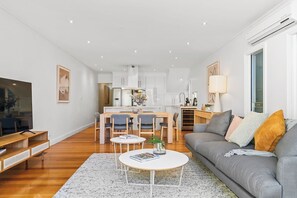 LIVING ROOM: The large, spacious Living Room is bright and perfect for relaxing, dining or entertaining. 