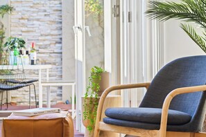 LOUNGE: The relaxing sunny lounge room looks out to the courtyard garden. 