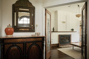 GROUND FLOOR ENTRANCE. Your own private entrance opens to collected original antiques including this 19th Century French Boulle Inlaid Credenza. The hall opens to the separate lounge room.  