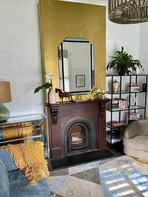 DELIGHTFUL DECORE: The home is decorated with a collection of furniture, artworks and decor items.