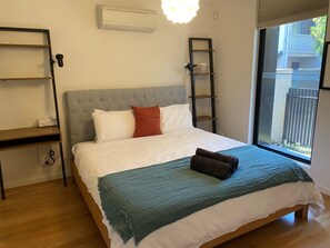 BEDROOM 1: Sunny, spacious queen bedroom with built in wardrobes and street outlook. Air conditioned. 
