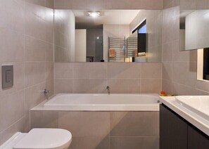 BATHROOM: The luxury  ground floor bathroom has a deep bath and large shower. 