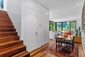 OPEN PLAN LIVING: The sunny, rear open plan dining, kitchen and living areas look out on the north facing garden. 