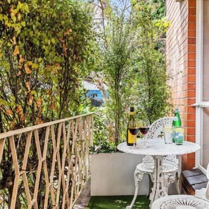 BALCONY: Off the living room is a private balcony that is perfect for an al fresco bite, coffee, reading a book or watching the passers by.