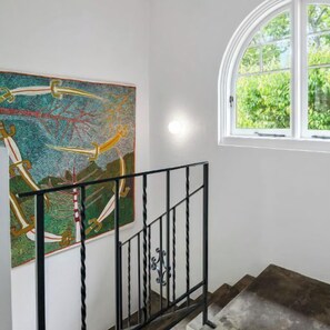 STAIRWELL: The stylish home contains many classic Art Deco features and fine art.