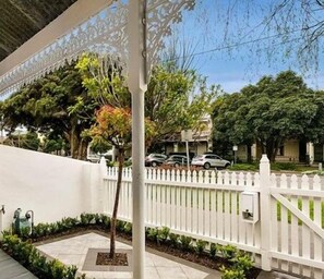 STREET VIEW: The front garden look out on a premier Albert Park street lined with original Victorian terraces. 