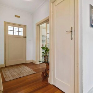 LAUNDRY: The apartment features a European laundry off the hall with a large washing machine and heat pump dryer. An iron and ironing board is provided in the Bedroom 1 wardrobe.