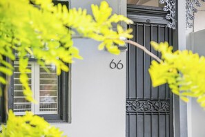 ENTRANCE: Enter 66 Richardson Street and you will be struck by the soaring ceilings and wide board oak floors that bathed in light from the skylights in the ceiling. The front porch has an outdoor table and chair for relaxing.