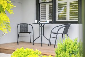 VERANDA: Sit and relax and watch the world go by on the front veranda table and chairs.