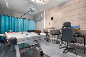 Challenge your friends to a game in this vibrant game room featuring air hockey and foosball.