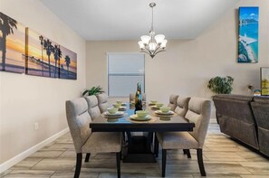 Gather for meals in this beautifully designed dining space, perfect for hosting family dinners.