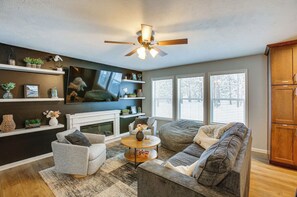 The living area is complete with a sleeper sofa, fireplace, and wifi connected television with access to Youtube TV, Netflix, and more!