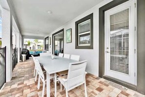 Dine al fresco in this inviting outdoor space with a large table and seating for eight.