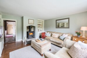 Dovehayes Cottage, Bourton: Relax in front of the wood burning stove
