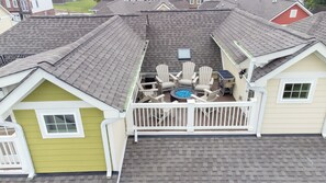 Rooftop balcony with fire pit and seating