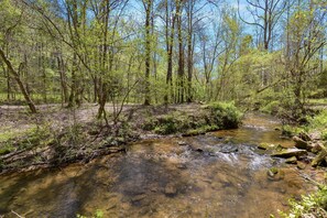 Peaceful sounds of Sugar Creek rushing over the rocky creek bed