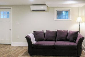 Living Room with Queen Sofa Bed and Front Door