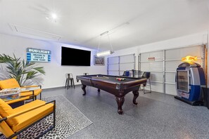 Game room 85" tv, slate pool table, board games, darts, & mini basketball goal
