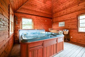 The private hot tub hut is sheltered from the elements.