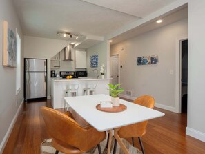 You are able to socialize from the kitchen and the dining area