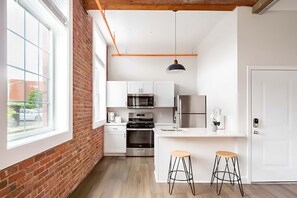 Kitchen includes a dishwasher and gas stove