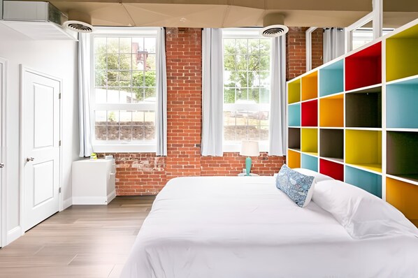 King bed with some unique detailing in the bedroom