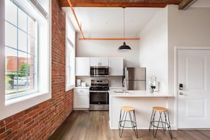 Kitchen includes a dishwasher and gas stove