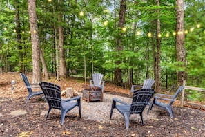 Outdoor fire pit and seating area. Enjoy conversations, drinks and smores.