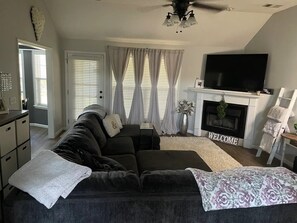 Living room area.
Large sectional couch 
55 inch Roku TV with YouTube TV service