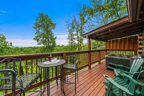 We have a spacious deck with beautiful views of the surrounding woods.