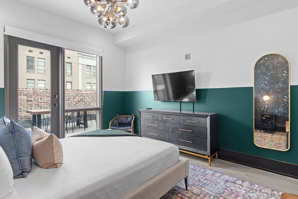 Retreat to the primary bedroom with a plush king bed, walk-in closet, blackout shades, and a smart TV. Designed for comfort and privacy, this suite is perfect for recharging after a day exploring New Orleans.