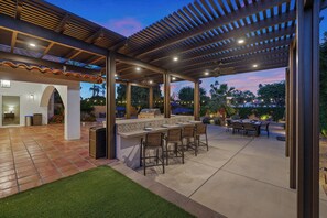 Unleash your inner mixologist and have a drink from one of the four bar-height stools.