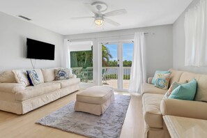 A wall mounted TV with Xfinity cable is located in the main living area.