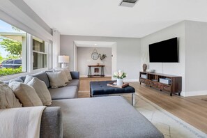 The sectional sofa with chaise lounge in the living room invites you to put your feet up and relax.