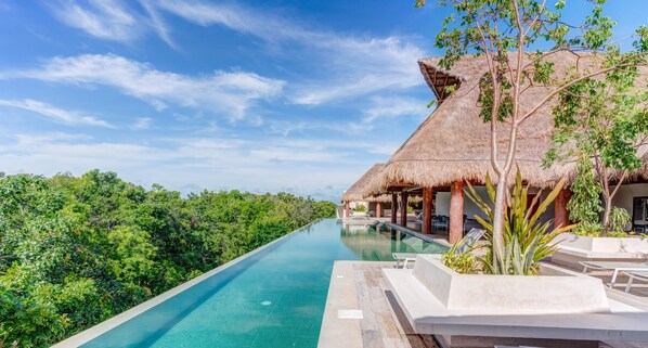 The Paramar VIVA rooftop pool with sweeping jungle treetop views
