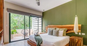 Bedroom 1 has a plush king bed & private balcony access with comfy Acapulco garden chairs!