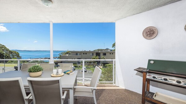 Patio with BBQ, outdoor seating and water views