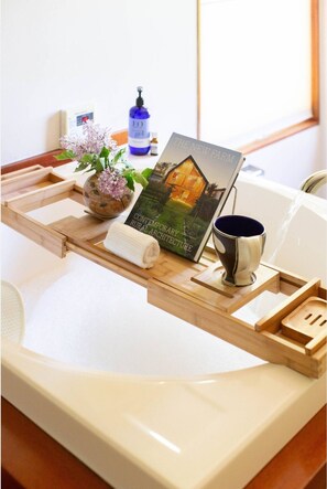 The Japanese soaking tub faces is the epitome of relaxation! Take in long range views of Roan mountain while soaking deep in the tub listening to nature.