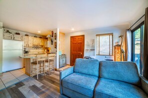 Living area open to kitchen. Couch is a queen sized, memory foam, sleeper sofa.