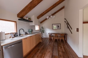 Step into this beautifully designed kitchen, where modern functionality meets rustic charm.