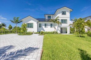 Front of home W/ large driveway