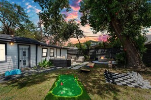 Enjoy outdoor fun, where you can challenge friends to life-size chess, play golf, cornhole, cup pong, horseshoes, or Jenga. And when the sun sets, the magic begins—play under the twinkling string lights, or unwind by the cozy firepit or the patio