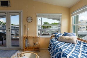 Bright and airy daybed area with canal views
