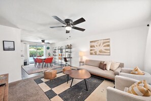 Cozy and inviting living space with plush seating and a smart TV.