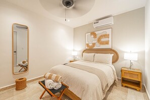 Cozy and inviting bedroom with plush bedding for a restful night's sleep.
