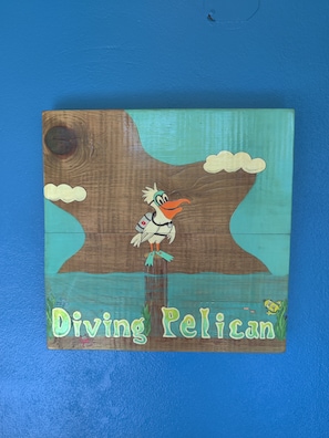 Diving Pelican sign