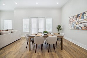 Dine in Elegance 🍽️ - Enjoy home-cooked meals in this stylish dining space with a view of the gourmet kitchen.