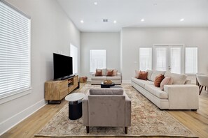 Comfort & Entertainment 🎬🍷 - Cozy up with a movie or enjoy a gathering in this stylish living space!