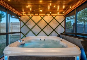 Unwind in this inviting hot tub after a day of adventure, letting the warm water soothe your muscles.