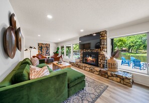 A chic and comfortable living room where style meets comfort, making it a perfect place to relax.